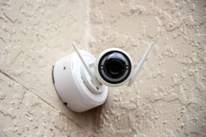 Home security camera mounted on a wall